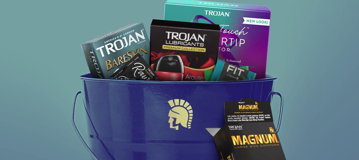 Trojan lubes, condoms and toys inside a bucket with the Trojan logo displayed on the front.