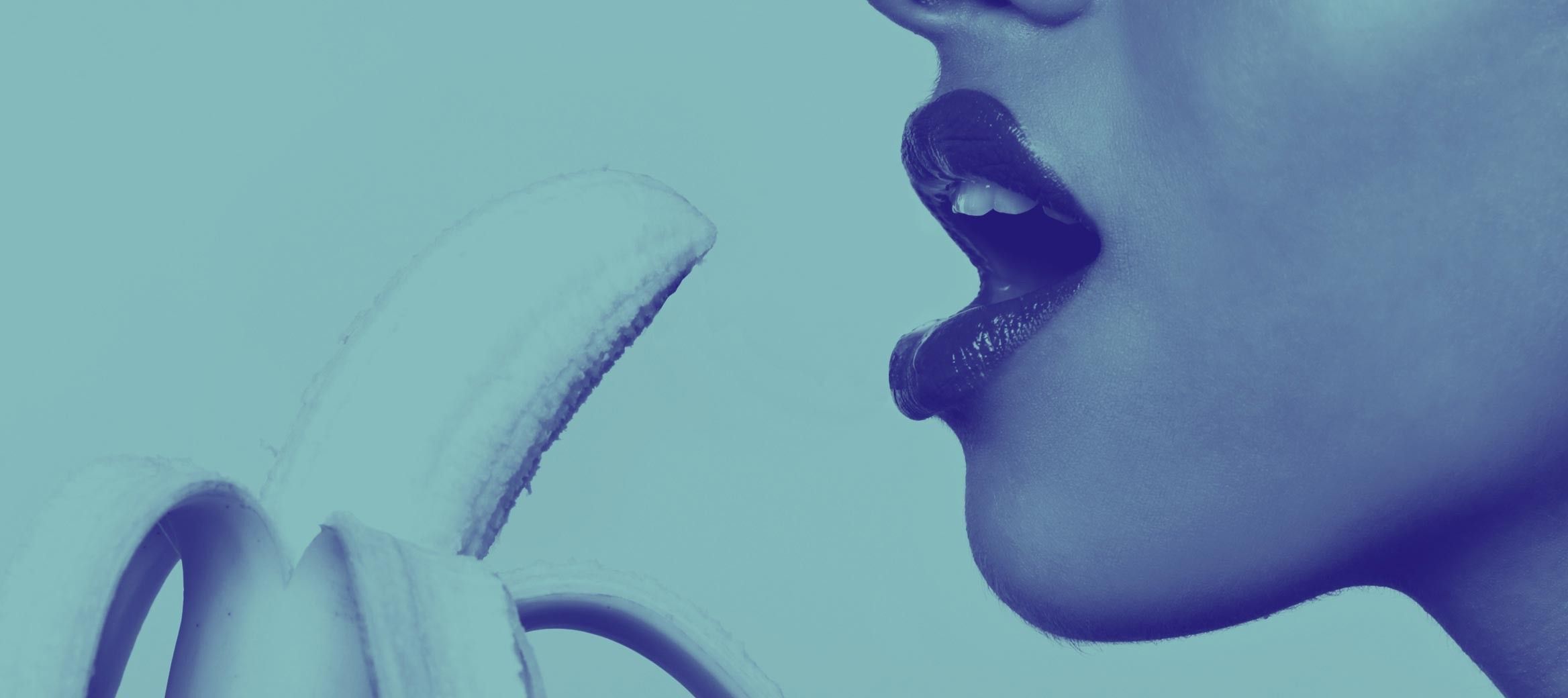 Woman eating a banana sexually.